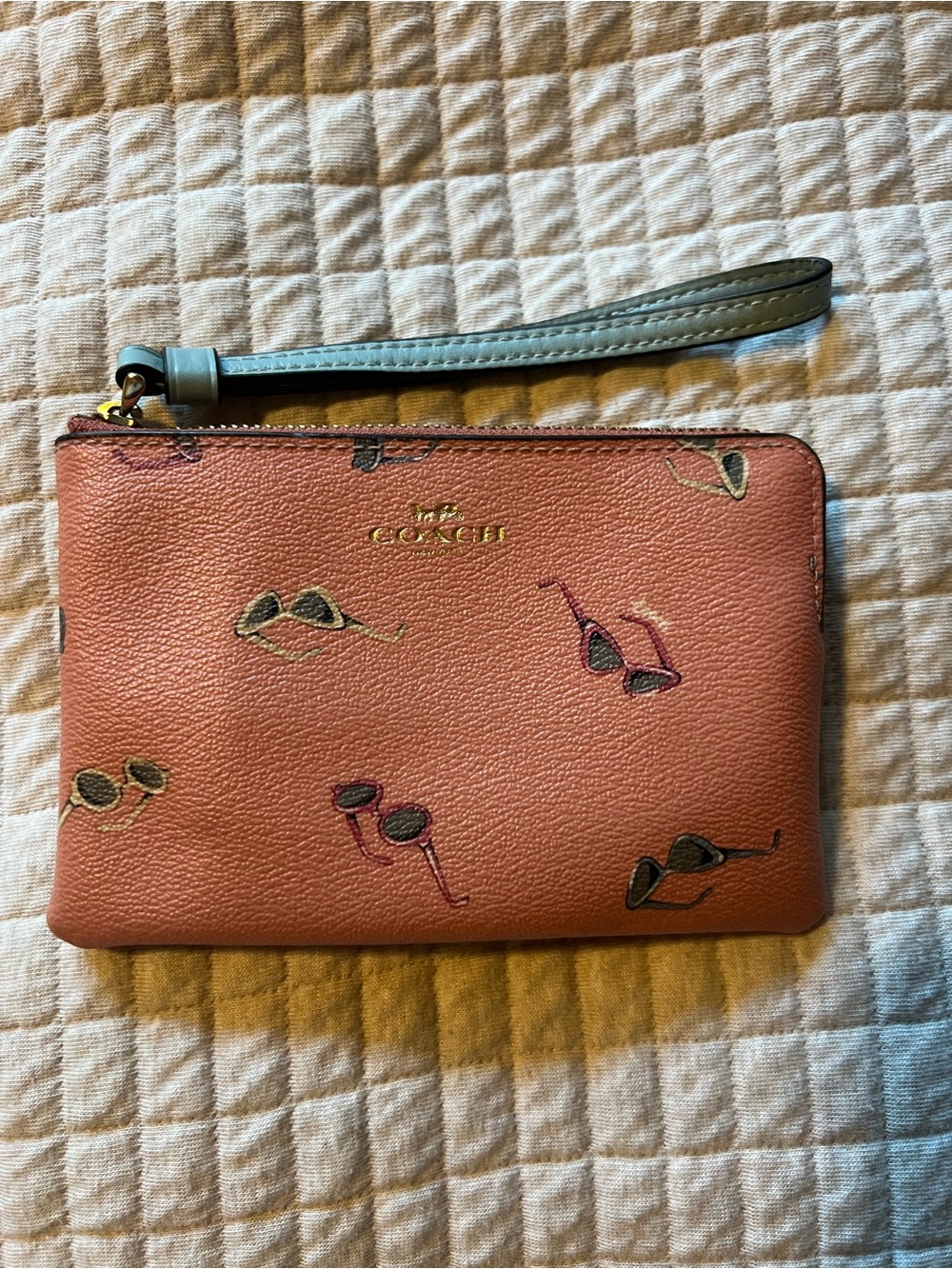 Coach Coral Pink Leather Wristlet with Sunglasses Print